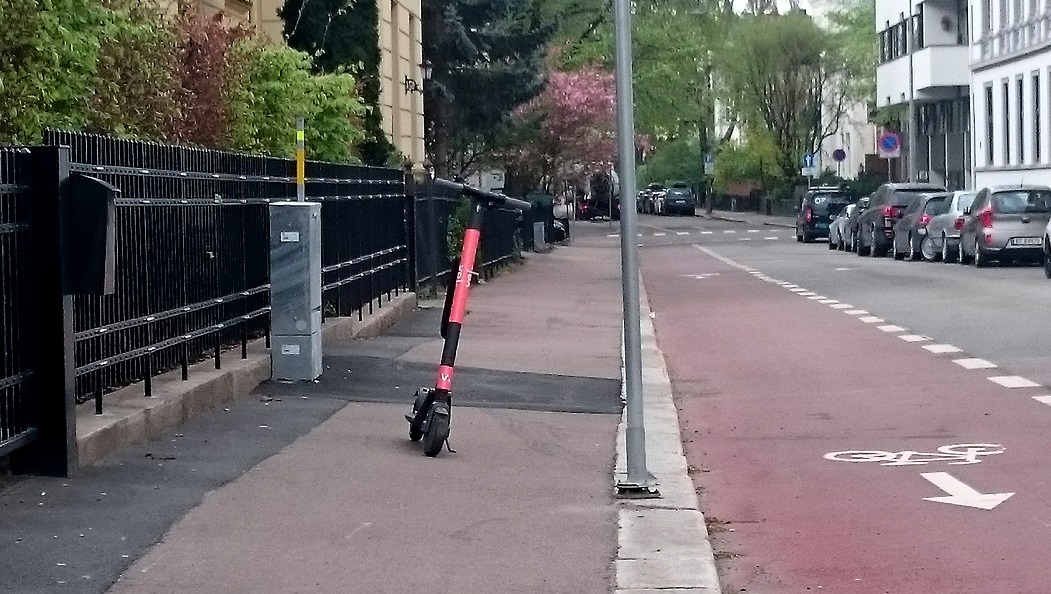 A scooter blocking the footpath