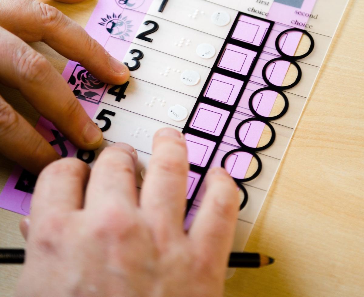 A tactile voting device in use