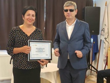 EBU being presented with a certificate of gratitude for its support by President Dima