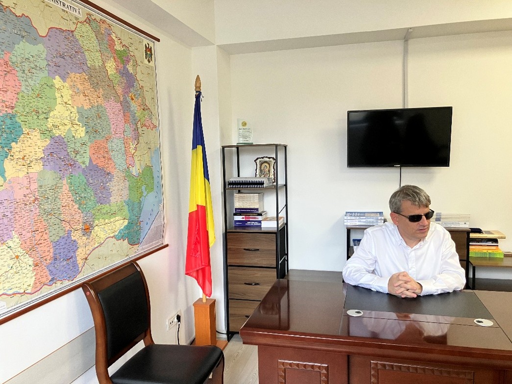 Mihai Dima, President of the Romanian Association of the Blind in his office