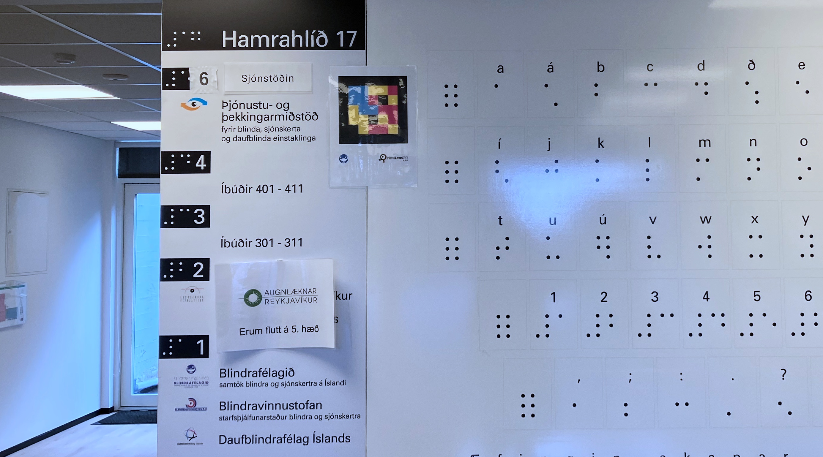 the Icelandic Braille alphabet and building signs in the lobby of the BIAVI building