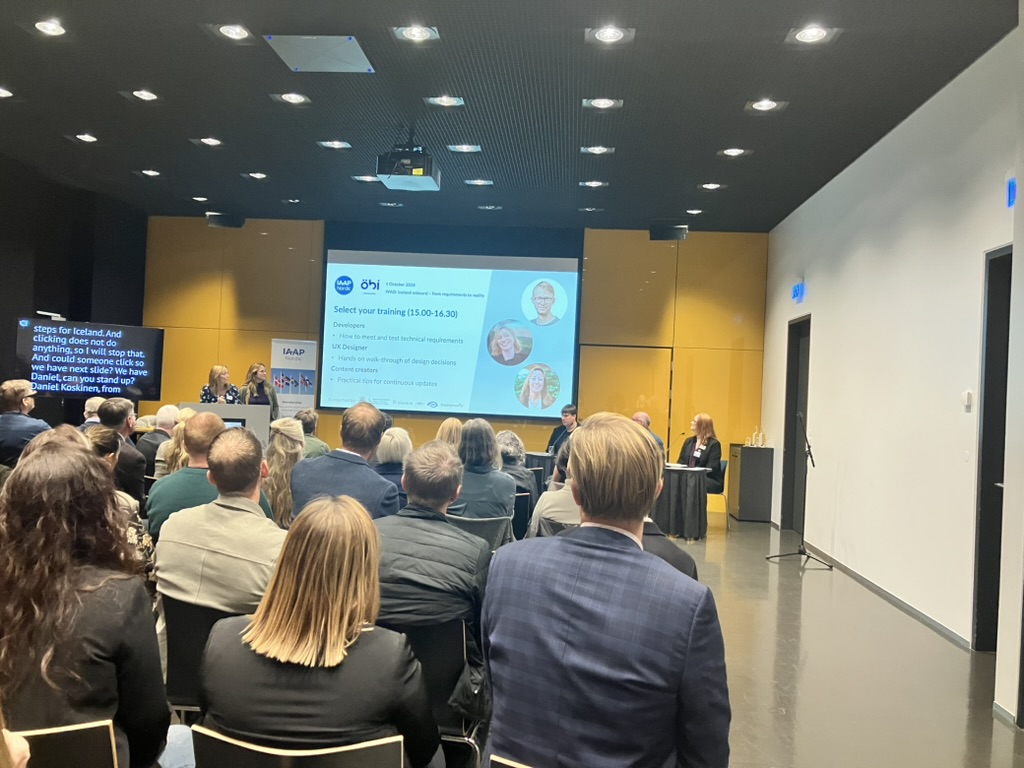 audience and screens at the “WAD Iceland Onboard - From Requirements to Reality” conference