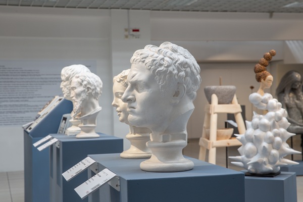 A line of tactile busts with descriptive panels