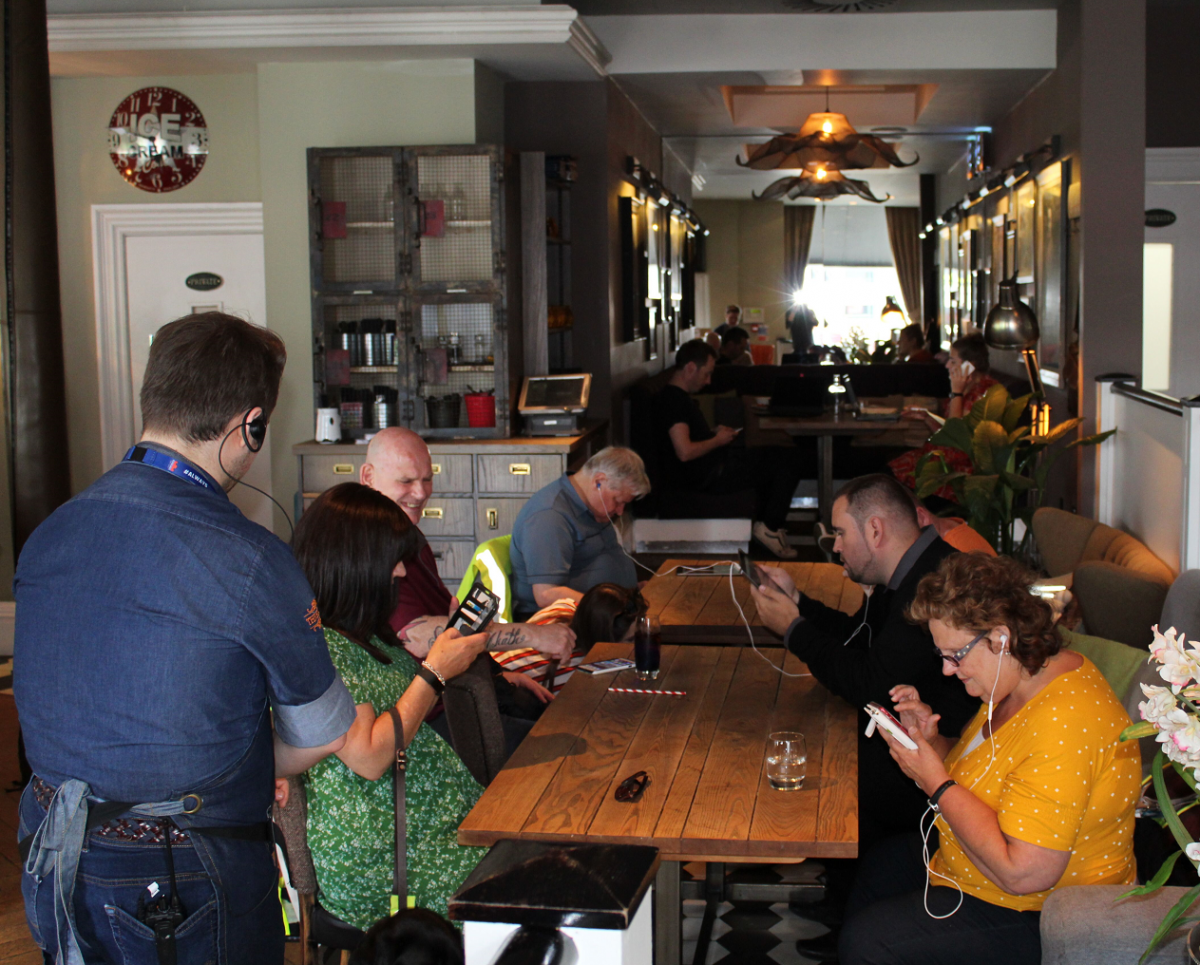 visually impaired Clients trying out the audio-menu at The Huxley.